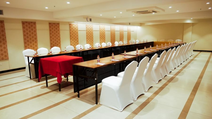 A spacious conference room with multiple tables arranged for a seminar or workshop at Shilton Dee Cee.