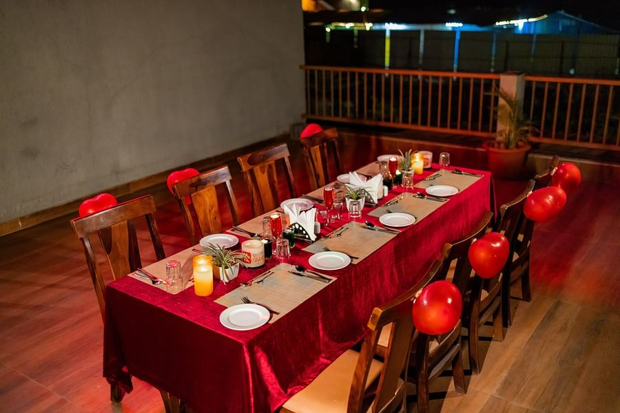 Table setup on the terrace, arranged for a celebration or private dining experience - Mastiff Grand La Villae Resort, Lonavala