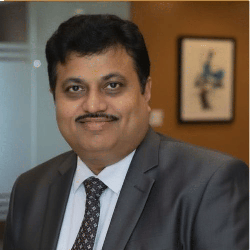 Management team member in professional attire at Pride Hotels Group.