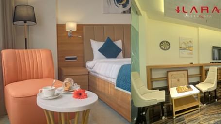 A cosy hotel room with a pink chair, white bed, and ILARA branding on the wall at Ilara Hotels & Spa.