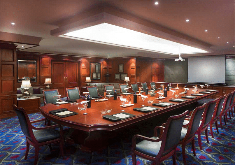 Food seating arrangement with chairs and table at Grand Chennai By GRT Hotels.