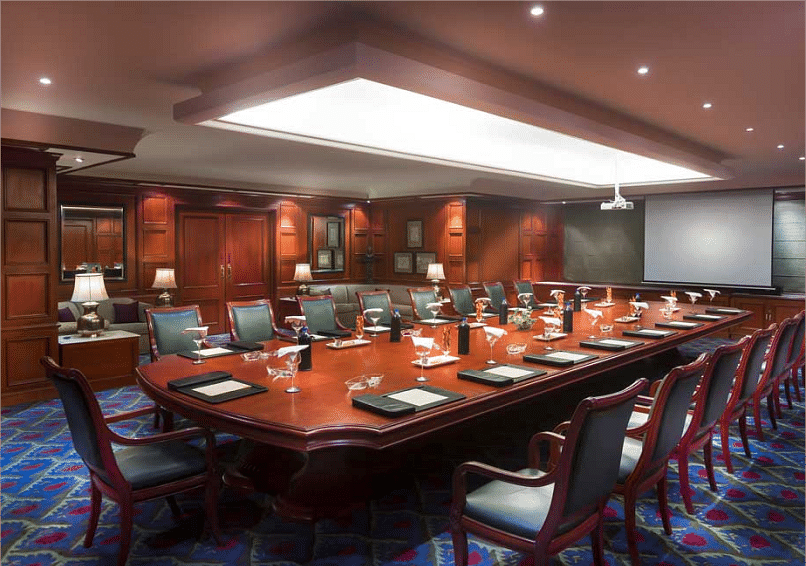 Food seating arrangement with chairs and table at Grand Chennai By GRT Hotels.