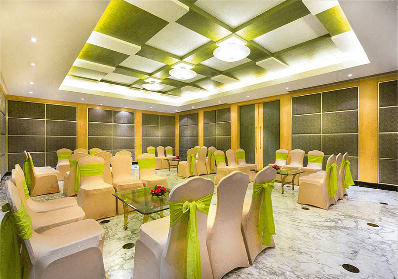 Food seating arrangement with chairs and table at Grand Chennai By GRT Hotels.