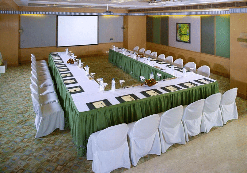 Food seating arrangement with chairs and table at Grand Chennai By GRT Hotels.