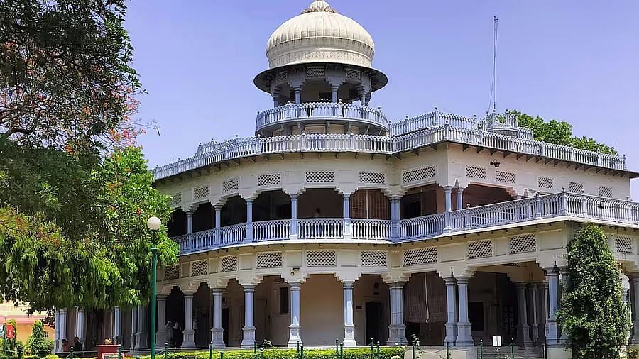 A grand building with a large dome and intricate architectural details.