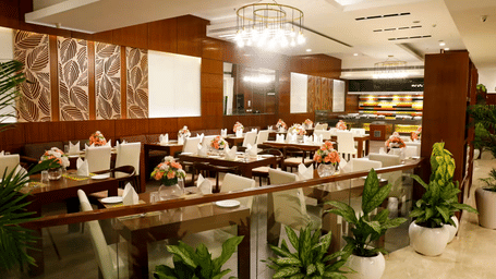 Elegant fine dining restaurant layout with modern seating at Nemesia Hotel Gurgaon.