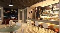 Shot of the lounge at our hotel featuring dim lighting with a bar counter. | Mirage Hotel