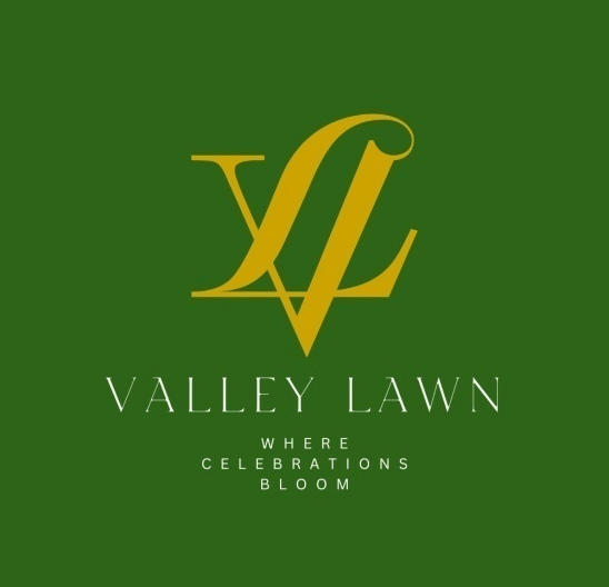 The logo of a space at The Heritage Club Tripura Castle Hotel and Spa, Shillong, featuring the name; The valley lawn and thr tagline.