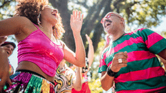 A view of People enjoying one of the New Year Events in Goa with a tree in the background.