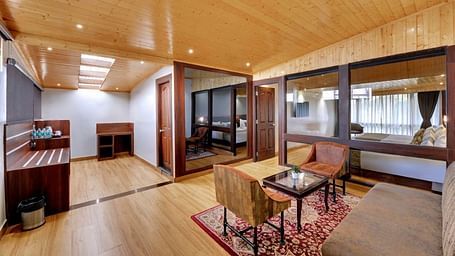 An image of a room with sofa sets, centre table and minimal decoration - Sumitel Vista TV Tower