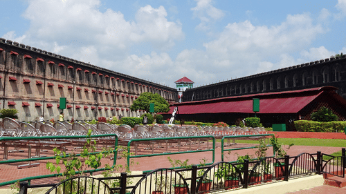 An overview of the exterior facade of the Cellular Jail with blue sky in the background.