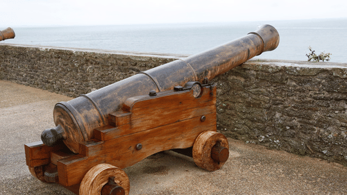 image of a huge cannon placed on to rest on a wall of a fortress