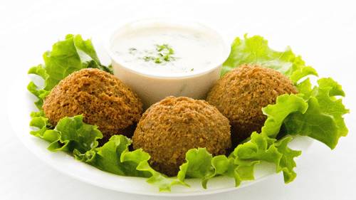 Falafel on a plate with mayo on the side