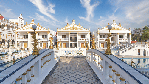 Grand palace-themed resort with ornate architecture and fountains.