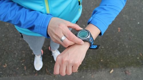 An image of a person looking into the smartwatch on their wrist