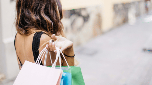 woman holding shopping bags