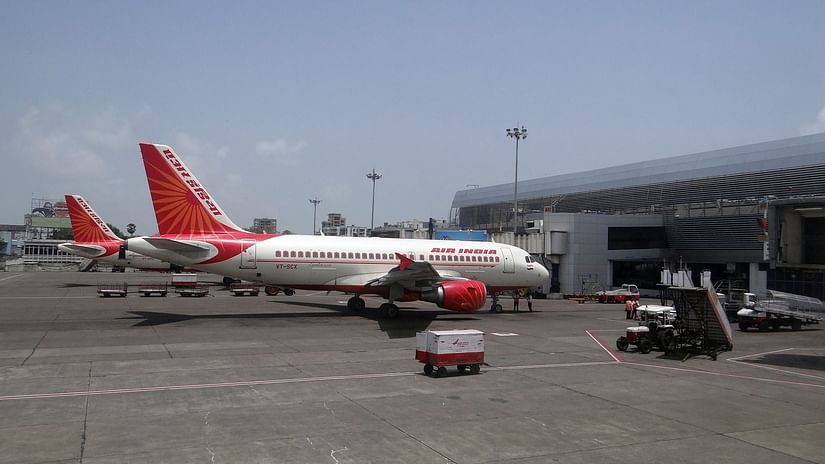 an image of the Air India aircraft perched at a airport during the day