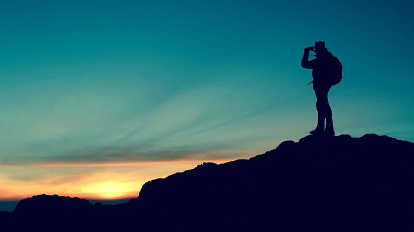 person standing on top of a holl