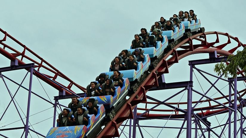 People sitting on a roller coaster