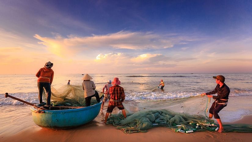 Fishermen using net for shore fishing