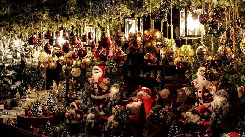 A christmas market selling lights hats and trees