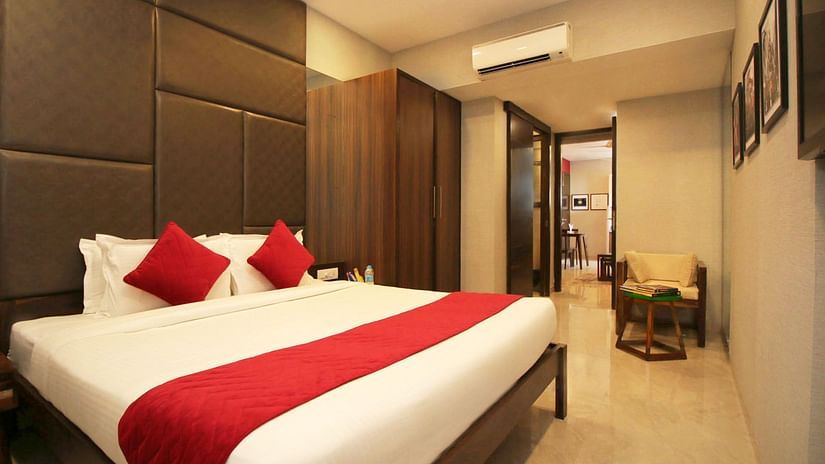 well-furnished room with cosy king size bed in khar