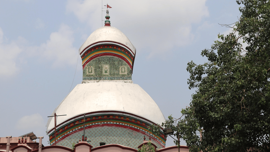 Kalighat Kali Maa Temple featuring subtle green accents set against a cloudy light sky