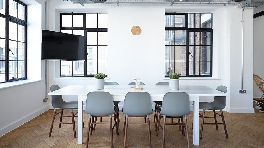 a meeting room with chairs and a table
