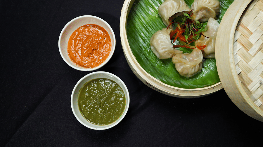Food at Woodstock Farmhouse, Shillong, in two small bowls, and a plate.