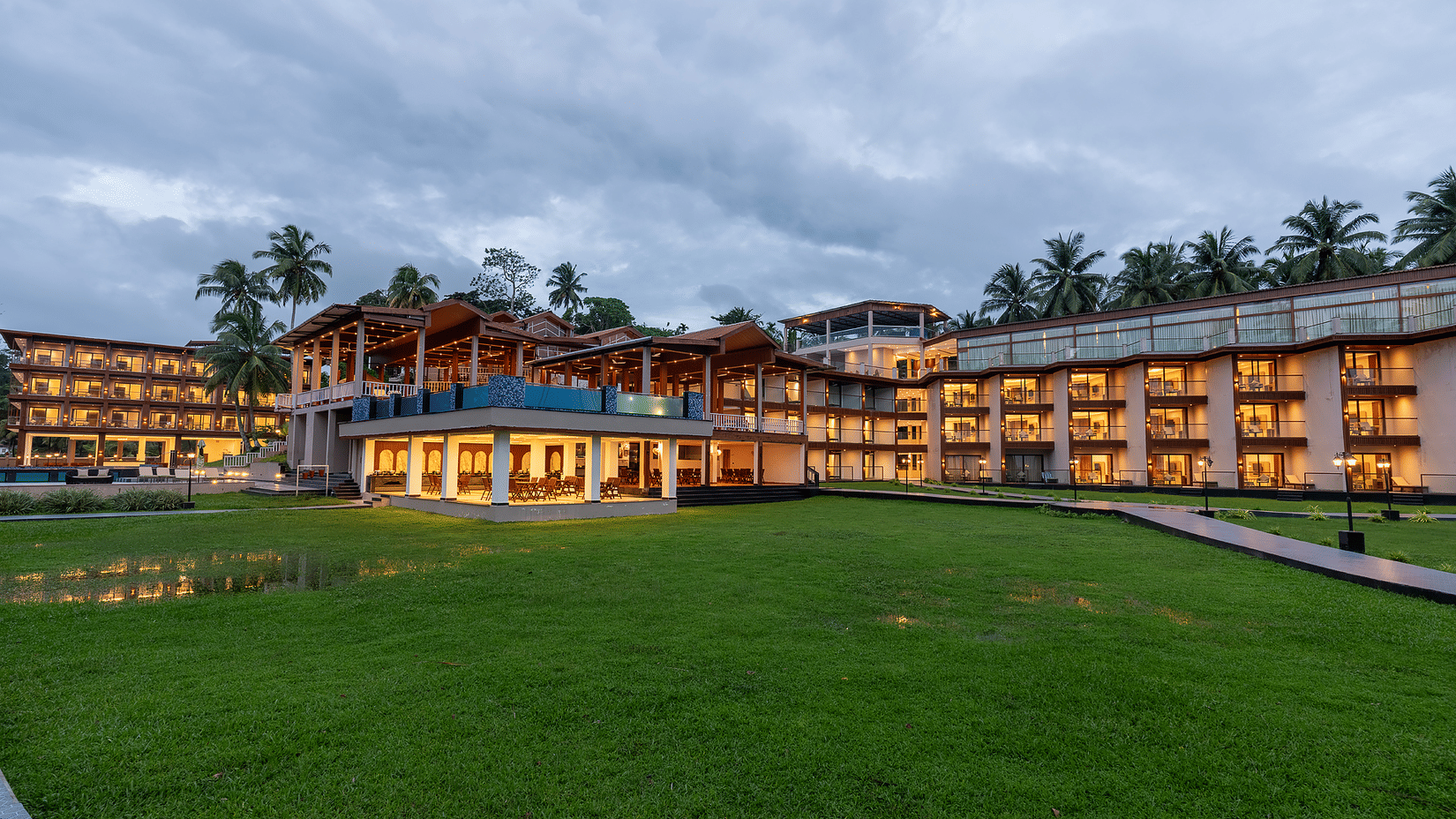 Exterior view of resort building and lawn at Silver Sand Sea Princess Beach Resort, Port Blair.