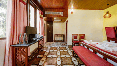 Cosy bed and scenic views from the window in the Deluxe Room at Silver Sand Village Resort, Havelock.