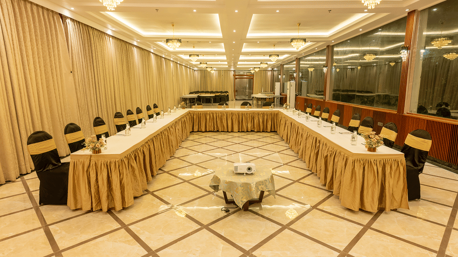 Conference hall with U-shaped table setup and draped decor at Silver Sand Sea Princess Beach Resort, Port Blair.