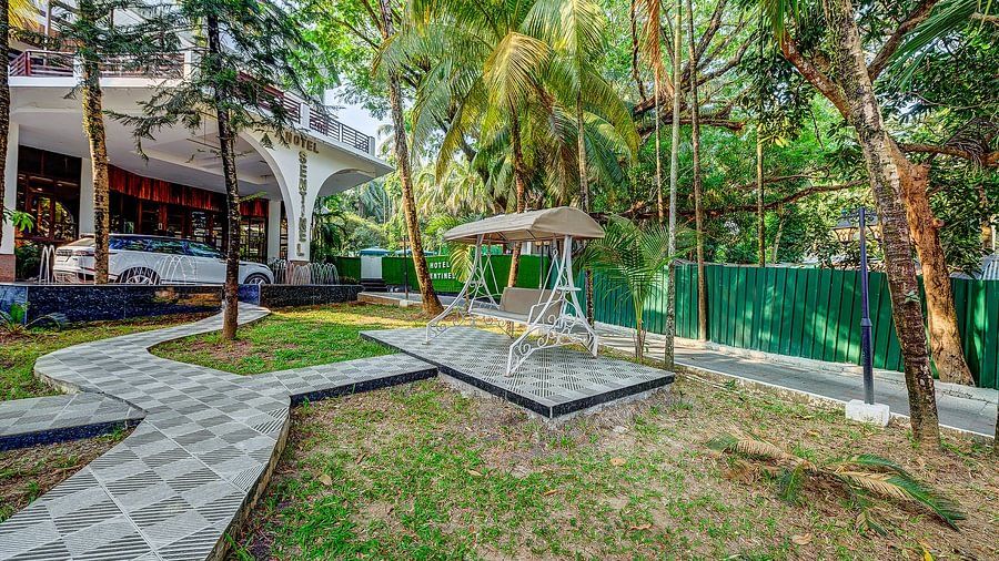 Outdoor garden area with a swing at Silver Sand Sentinel, Port Blair