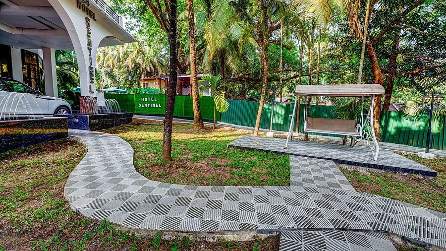 Outdoor garden area with a swing at Silver Sand Sentinel, Port Blair