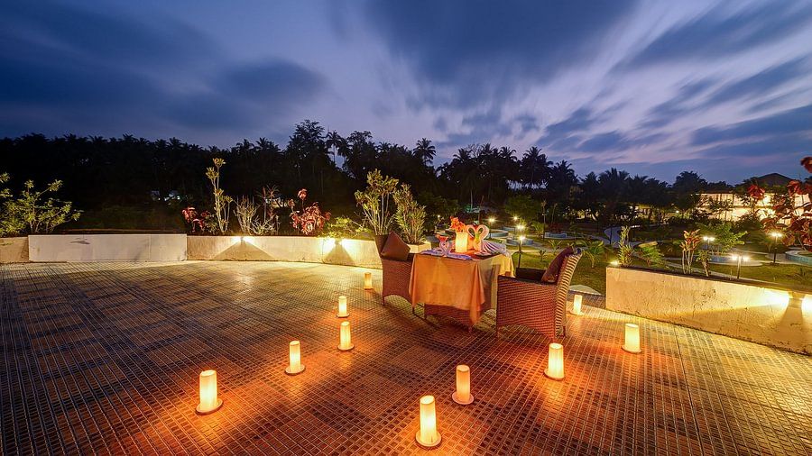 Romantic rooftop dinner setup at dusk at Silver Sand Village Resort, Havelock