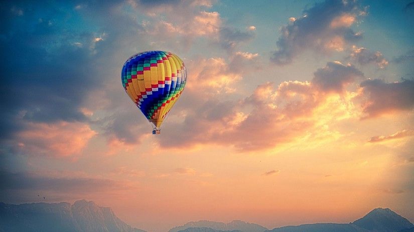 Hot air balloon in the sky with different hues in the background