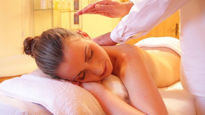 A woman enjoying a massage during her spa session