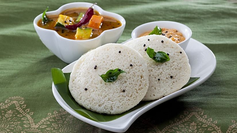 Idli and Sambar served in a banana leaf