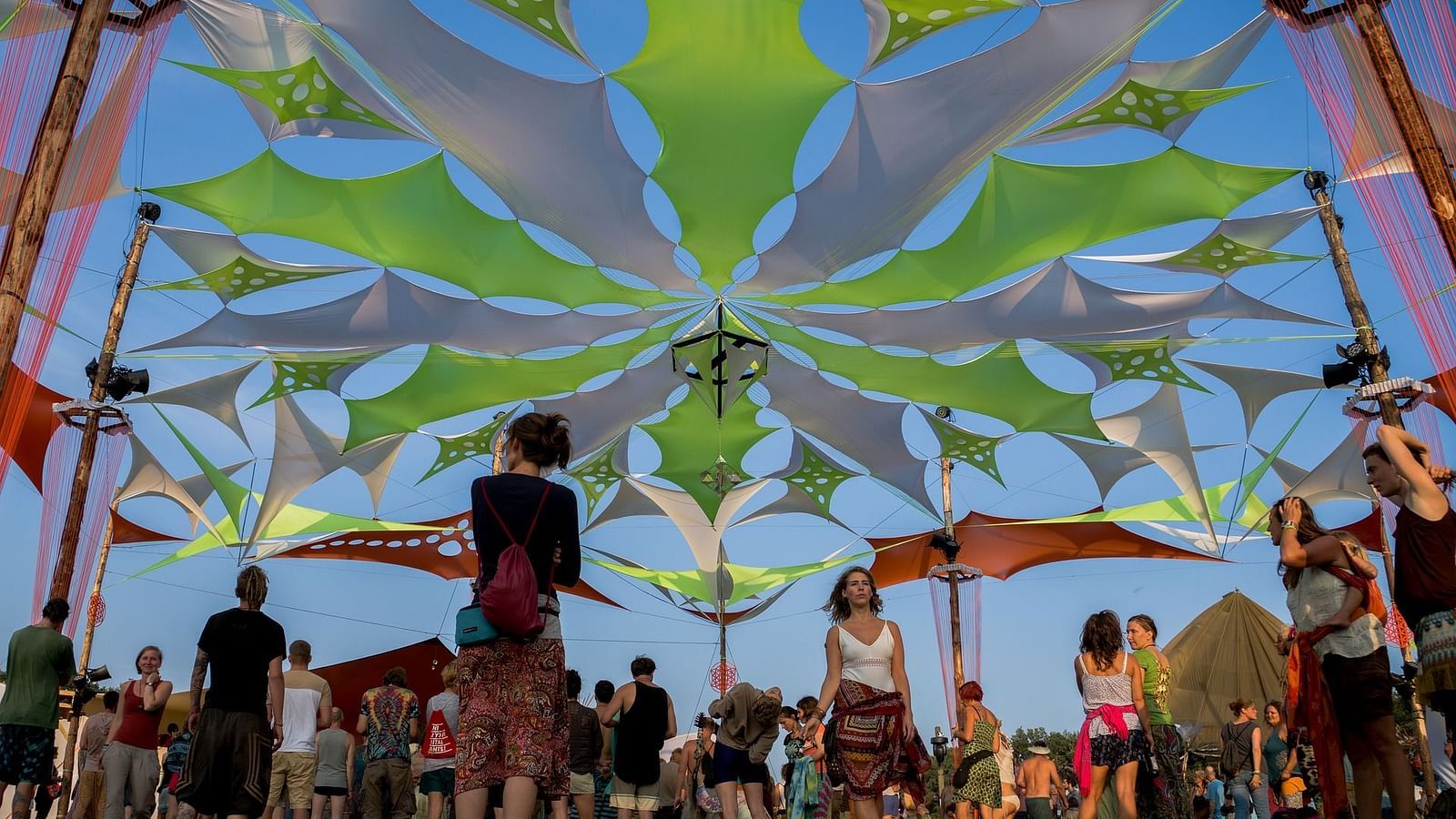 Image of a group of people with fancy decor above them.