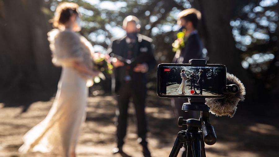 A wedding moment being captured with a video camera setup