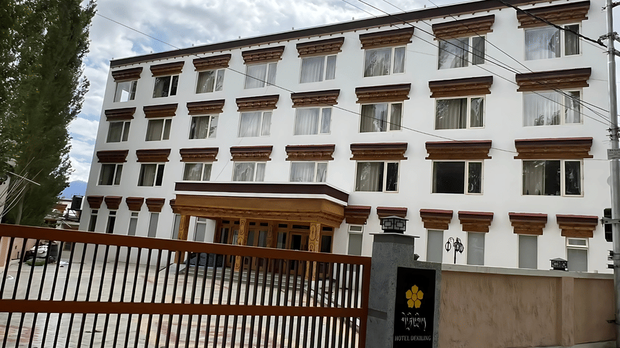 Exterior view of the multi-storey facade of Hotel Dekiling by Eastlynn Collections, Leh, behind a gated entrance.