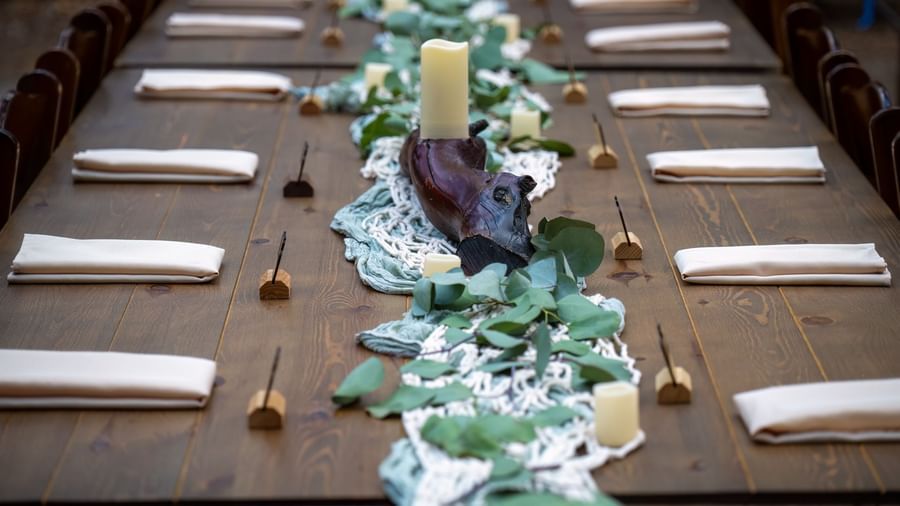 Close-up of elegant rustic dinner table setting at Kit Carson Lodge.