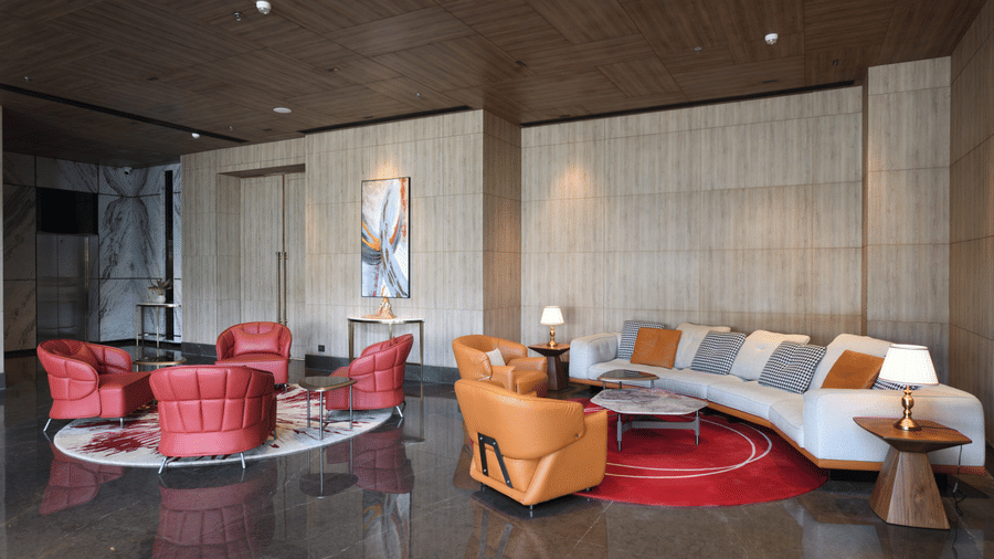 Stylish lobby lounge featuring comfortable seating, modern decor, and warm interiors at Ramada by Wyndham Sonipat Murthal.