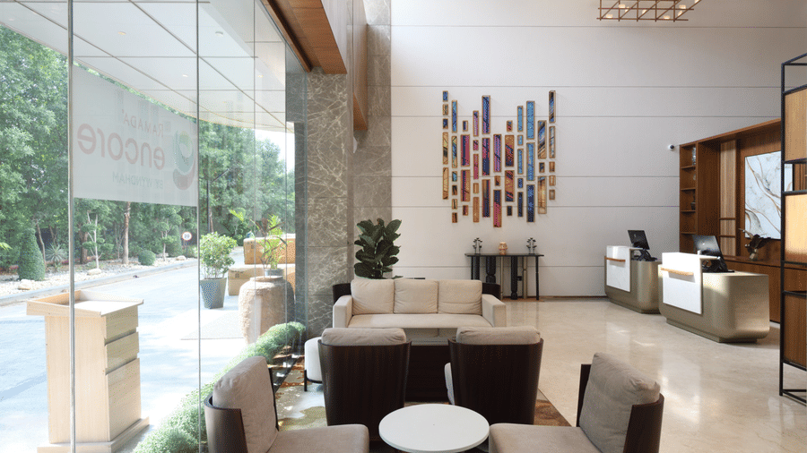 Contemporary lounge area with comfortable seating and natural light | Ramada Encore by Wyndham Gurugram Dwarka Expressway