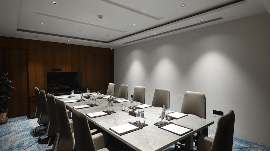 Conference room arranged for meetings with equipped tables and comfortable seating | Ramada Encore by Wyndham Gurugram Dwarka Expressway