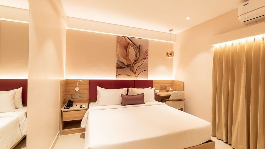 Elegant bedroom with soft lighting in The Executive Rooms at Livancia The Sojourn, Bangalore.
