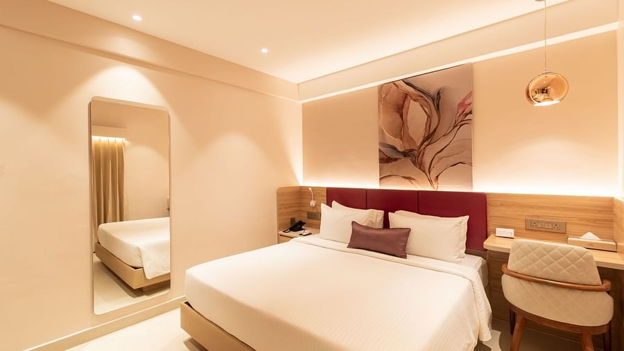 Comfortable bed setup in The Premium Rooms at Livancia The Sojourn, Bangalore.