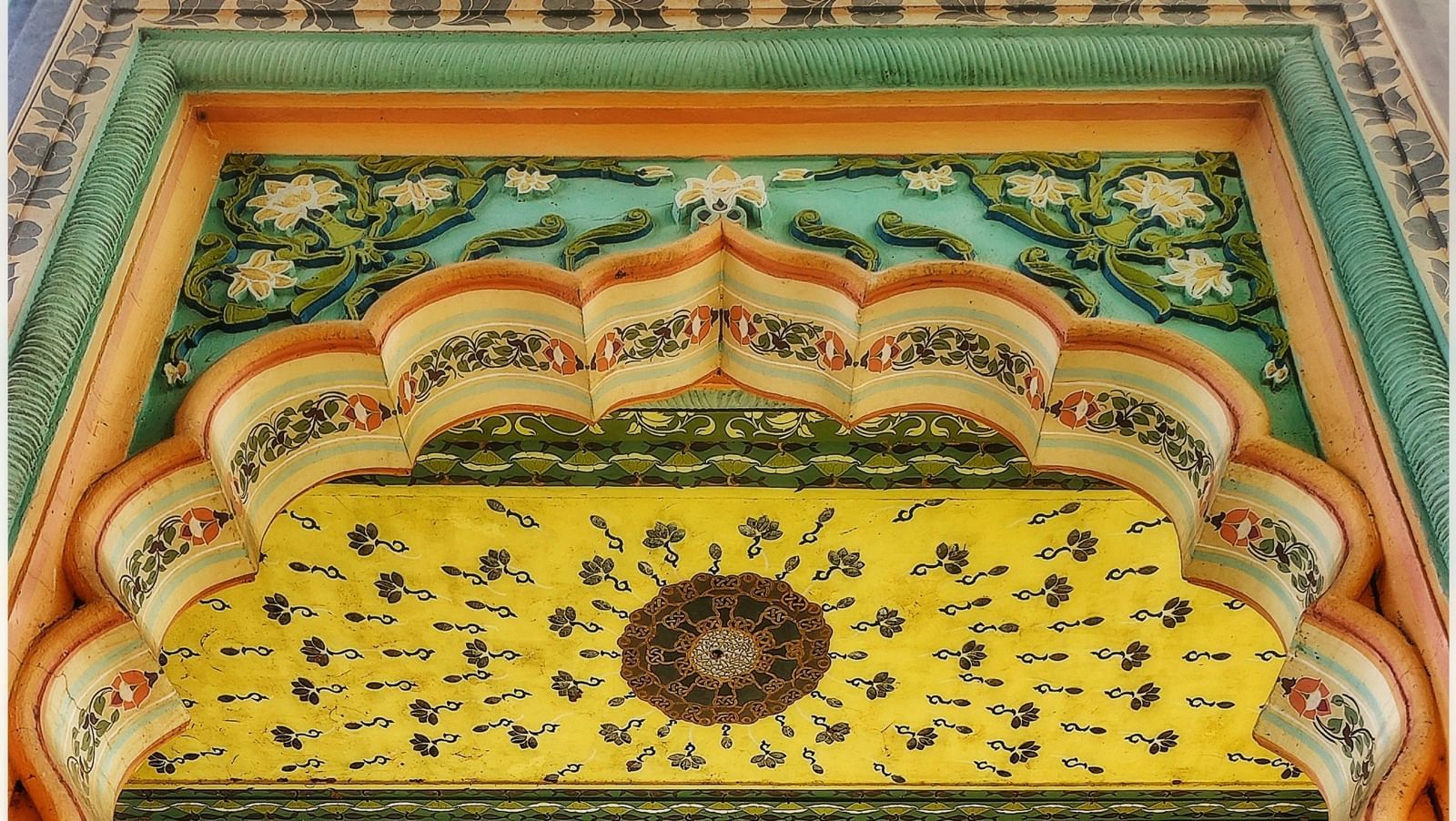 an overview of an entrance to a building in Jaipur, Rajasthan with colourful paintings