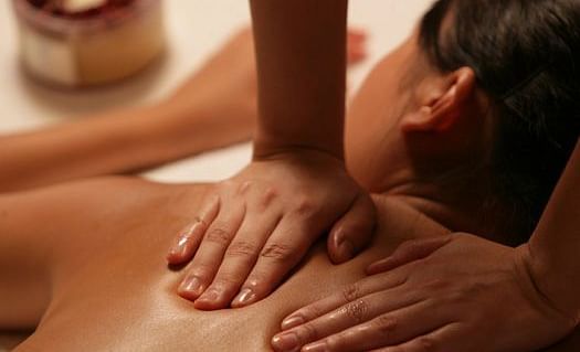 A soothing massage in a tranquil setting, highlighting relaxation and wellness. A perfect escape for rejuvenation | Brewery Gulch Inn & Spa