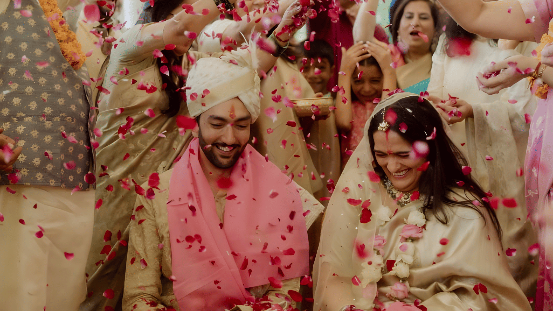 Guests celebrating with flowers during wedding function of Charvi & Dhruv at Umaid Palace.